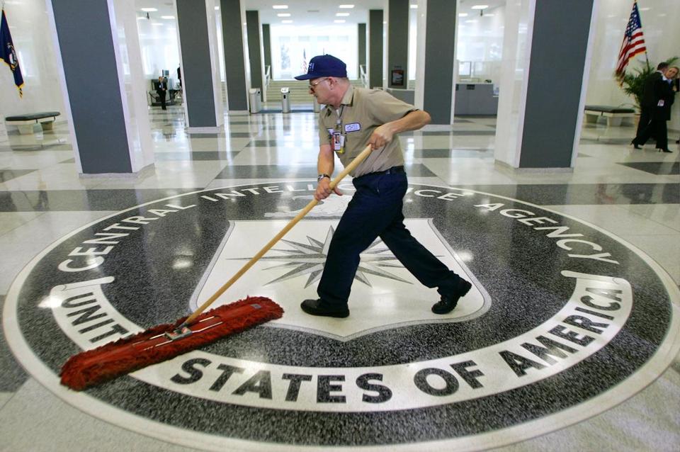 A workman slid a dustmop over the floor of CIA headquarters in Virginia. - ap/file 2005