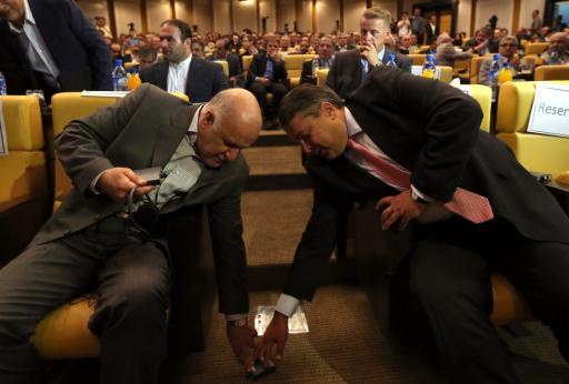 German Economy and Energy Minister Sigmar Gabriel (R) and Iranian Oil Minister Bijan Namdar Zanganeh (L) fall all over each other at Iran's Chamber of Commerce in Tehran on July 20, 2015, days after the nuclear accord was struck. (AFP/Getty Images)