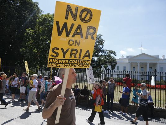 Anti-war demonstrators at the White House in 2013. (Photo: Charles Dharapak, AP)