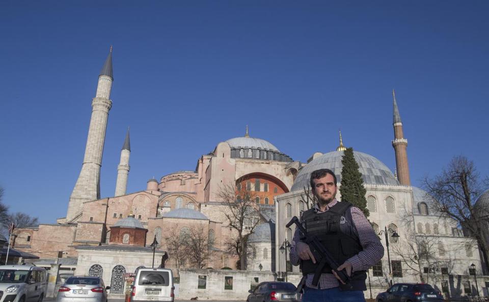 A Turkish policeman secured the area in front of the Hagia Sophia complex after an explosion nearby left at least 10 people dead Tuesday. - EUROPEAN PRESSPHOTO AGENCY