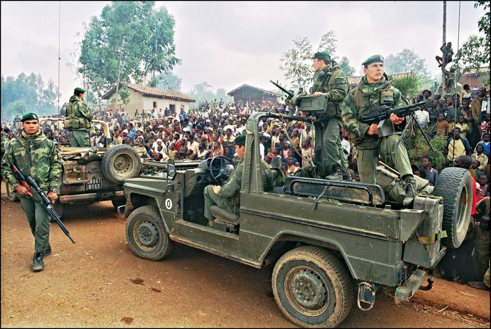 Hutus welcomed French marines on July 3, 1994, as they drove through a refugee camp in Rwanda. Hundreds of thousands of Rwandans were killed by the Hutu that year. - HOCINE ZAOURAR/AFP/GETTY IMAGES