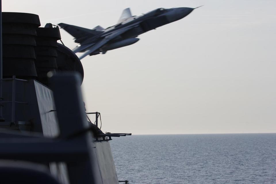 A Russian SU-24 jet makes a close-range, low altitude pass near the USS Donald Cook on 12 in the Baltic Sea. - US NAVY VIA THE ASSOCIATED PRESS