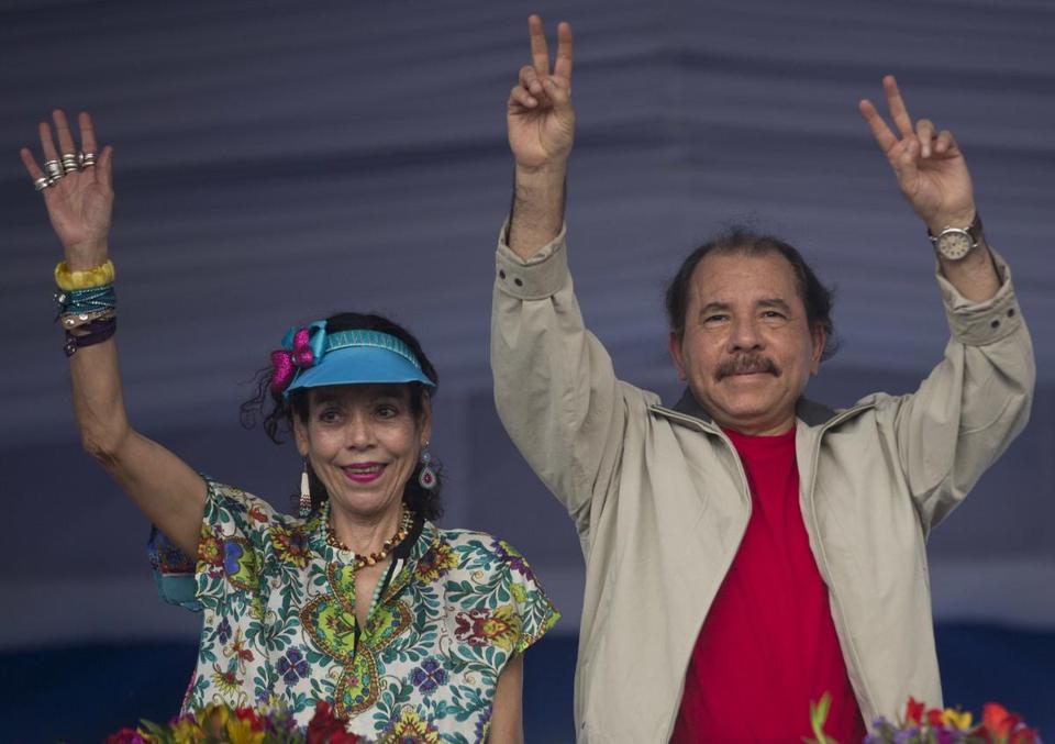 Nicaragua's President Daniel Ortega, right, and his wife, Rosario Murillo, waved to supporters on July 3, 2015. - ESTEBAN FELIX/ASSOCIATED PRESS