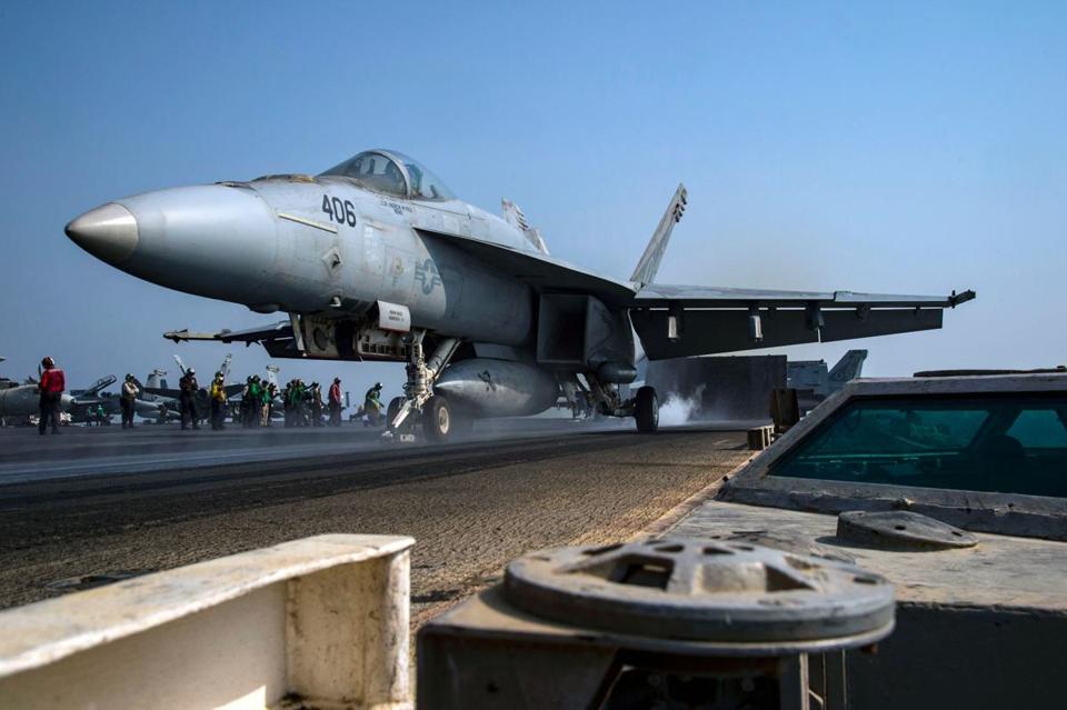 An F/A-18E Super Hornet launches from the flight deck of the aircraft carrier USS Dwight D. Eisenhower.
